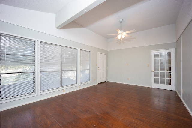 unfurnished room featuring ceiling fan, dark hardwood / wood-style floors, and beamed ceiling