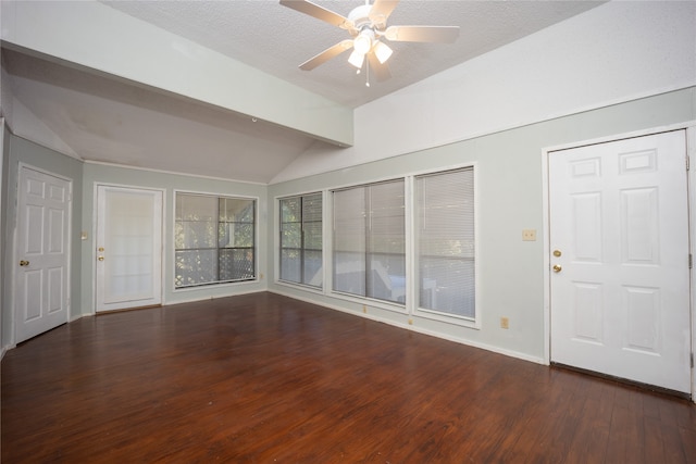 empty room with ceiling fan, dark hardwood / wood-style flooring, vaulted ceiling with beams, and a textured ceiling