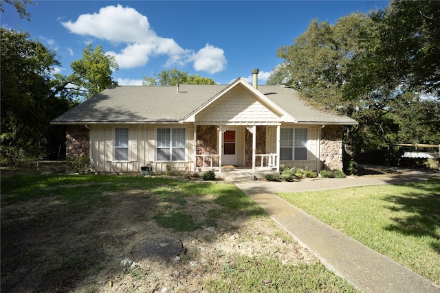 view of front of home with a front lawn and covered porch