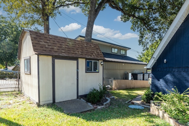 view of outbuilding with a lawn