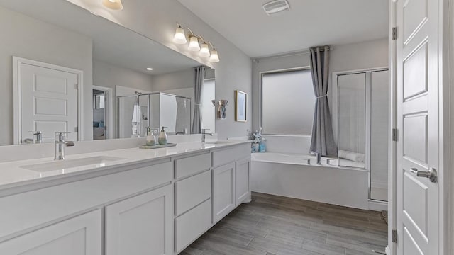 bathroom with vanity and plus walk in shower