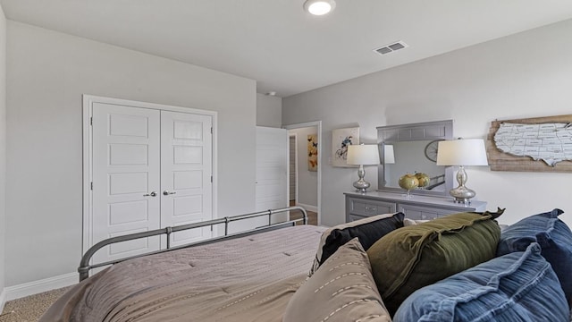 bedroom with carpet and a closet