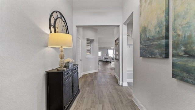 corridor featuring hardwood / wood-style flooring