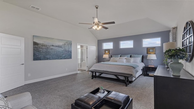 bedroom with ceiling fan, ensuite bathroom, and lofted ceiling