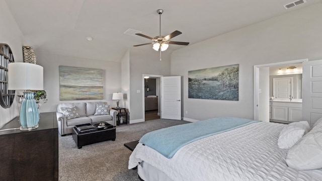 carpeted bedroom featuring ceiling fan, connected bathroom, and vaulted ceiling