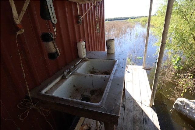 view of dock with a water view and sink