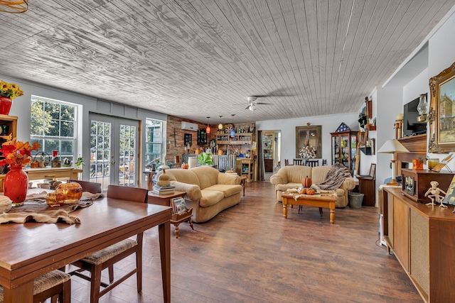 living room featuring wood ceiling, dark hardwood / wood-style flooring, bar area, a wall mounted AC, and ceiling fan