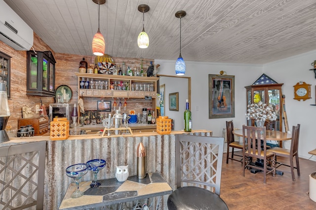 bar featuring pendant lighting, ornamental molding, wood-type flooring, wooden ceiling, and an AC wall unit