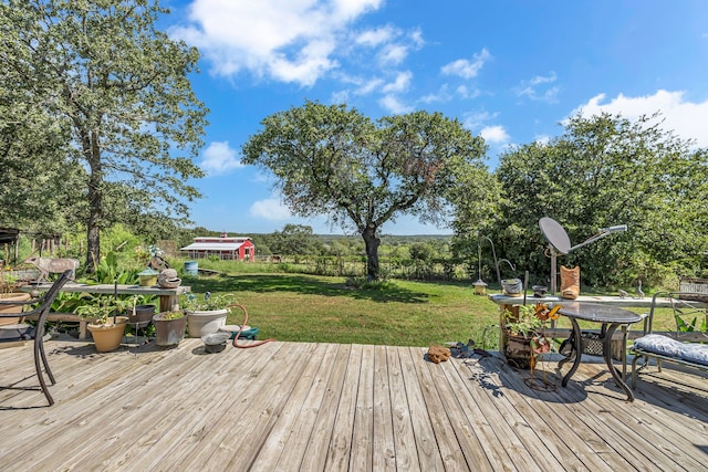 wooden deck featuring a yard