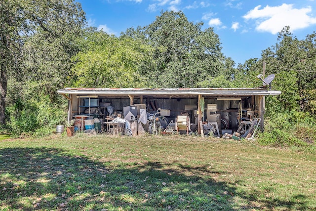 view of outdoor structure with a lawn