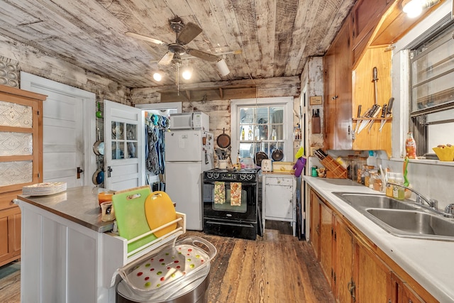 kitchen featuring white appliances, ceiling fan, dark wood-type flooring, and sink