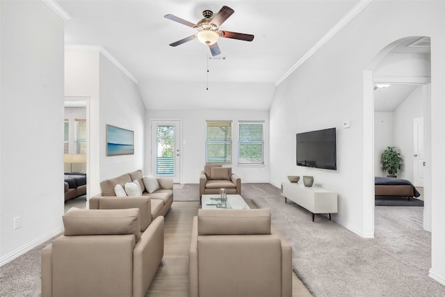 living room featuring light carpet, crown molding, and ceiling fan