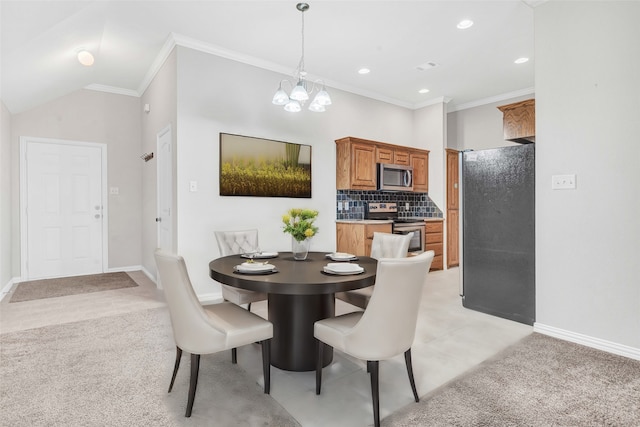 dining area with ornamental molding, light carpet, an inviting chandelier, and lofted ceiling