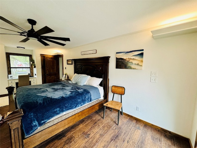 bedroom with hardwood / wood-style floors and ceiling fan