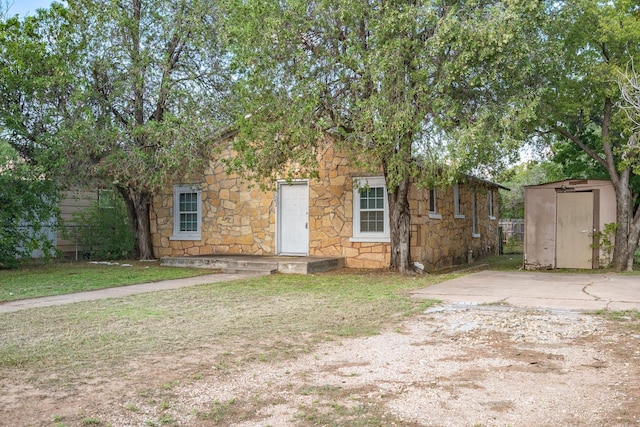 view of front of property with a storage unit