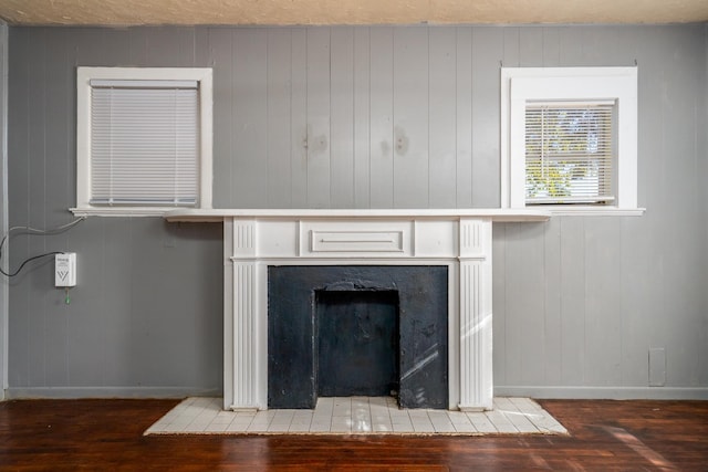 room details featuring wood walls and hardwood / wood-style flooring