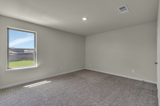 spare room featuring carpet