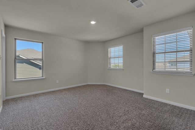 unfurnished room featuring carpet flooring