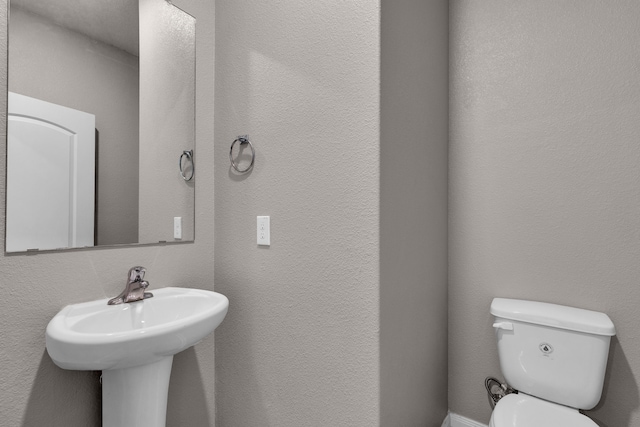 bathroom featuring toilet