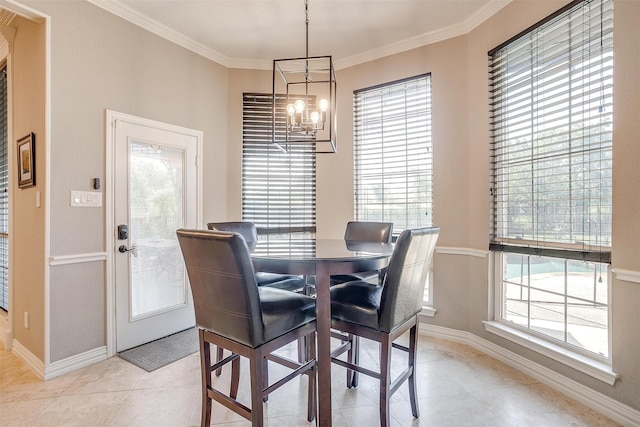 dining space with ornamental molding, a chandelier, and plenty of natural light