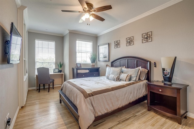 bedroom featuring ornamental molding, light hardwood / wood-style floors, and ceiling fan