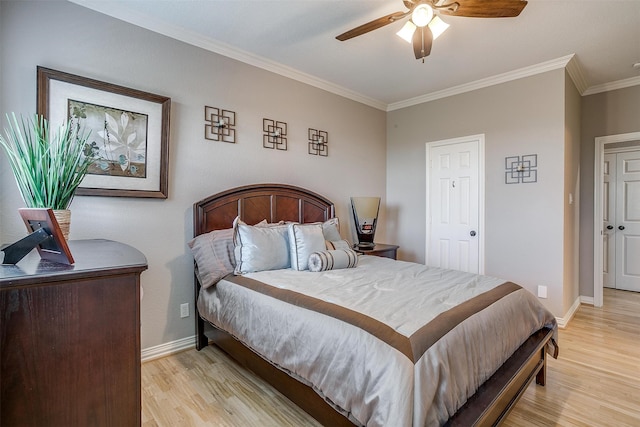 bedroom featuring ceiling fan, ornamental molding, and light hardwood / wood-style floors