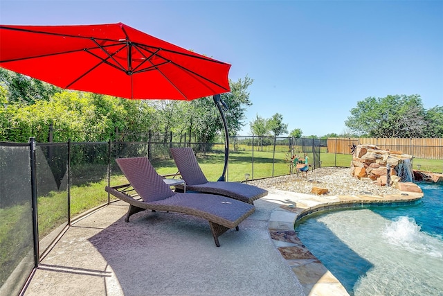 view of swimming pool featuring a yard and pool water feature