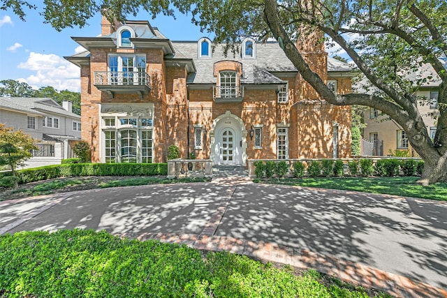 view of front of home with a balcony