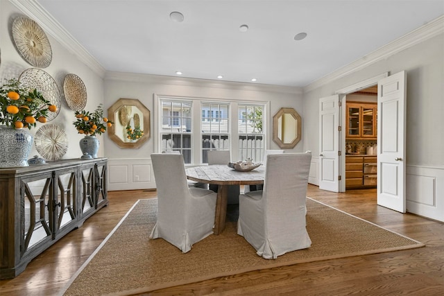 dining area featuring crown molding and dark hardwood / wood-style floors