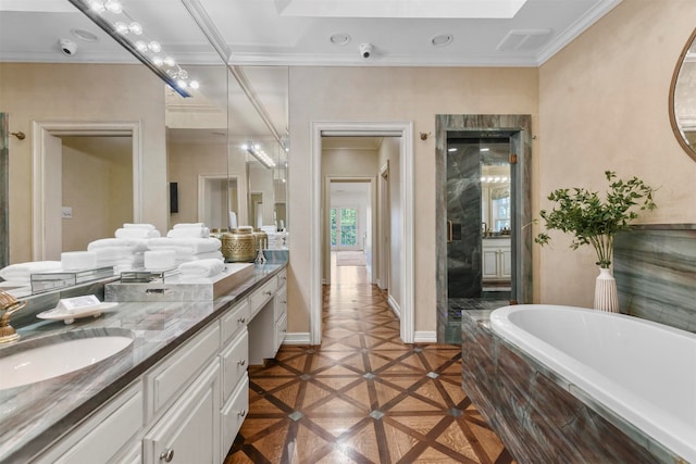 bathroom with vanity, tiled tub, and ornamental molding