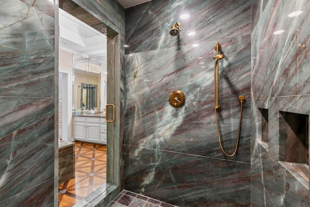 bathroom with vanity and a shower with shower door