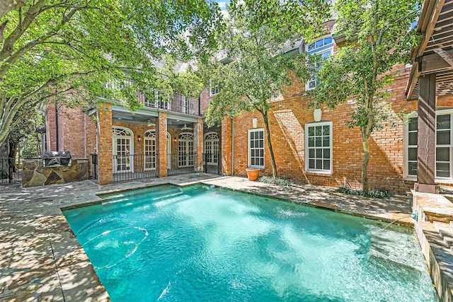 view of pool featuring a patio area