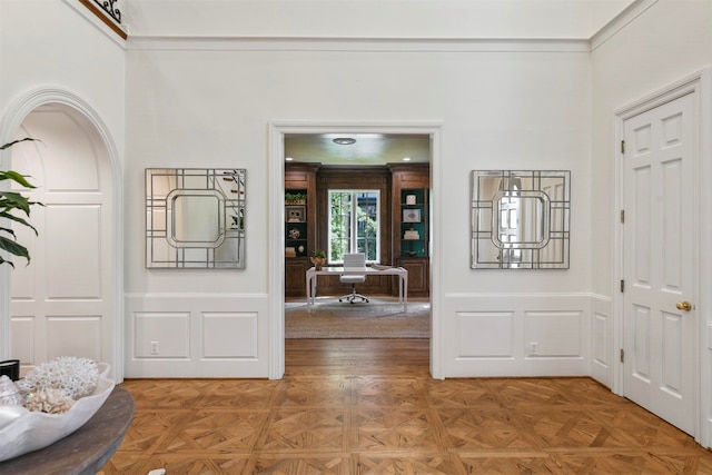 foyer entrance featuring parquet flooring