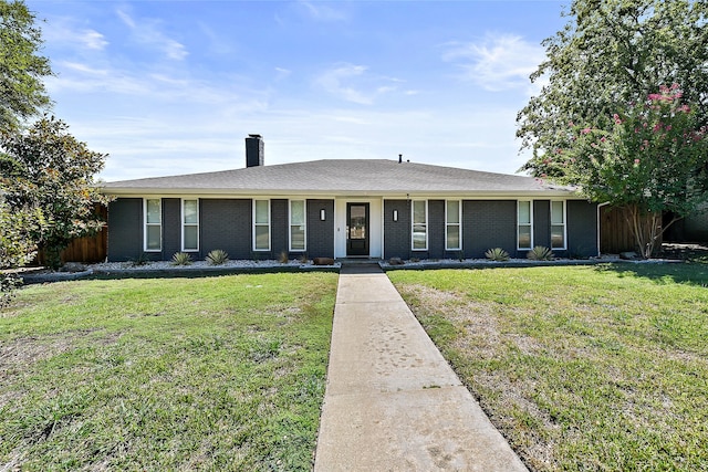 ranch-style home featuring a front yard