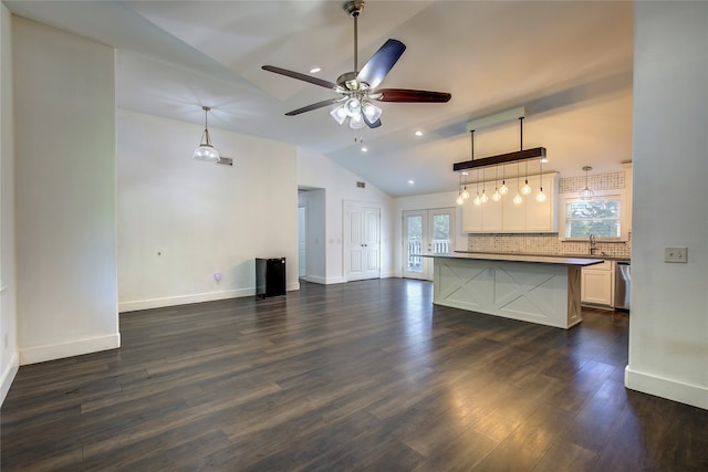 unfurnished living room featuring sink, french doors, ceiling fan, lofted ceiling, and dark hardwood / wood-style floors