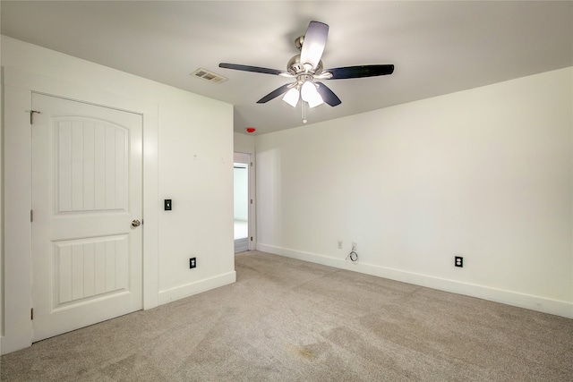 unfurnished bedroom with light carpet and ceiling fan