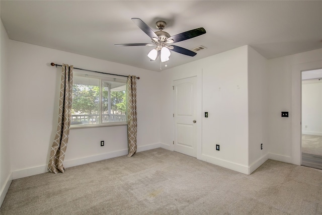 unfurnished bedroom with ceiling fan and light colored carpet