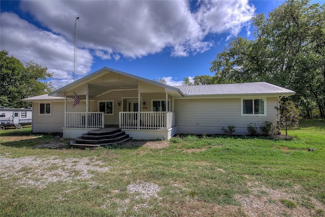 view of front facade with a front lawn and covered porch