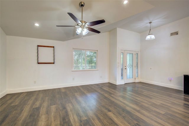 empty room featuring french doors, vaulted ceiling, dark hardwood / wood-style floors, and ceiling fan