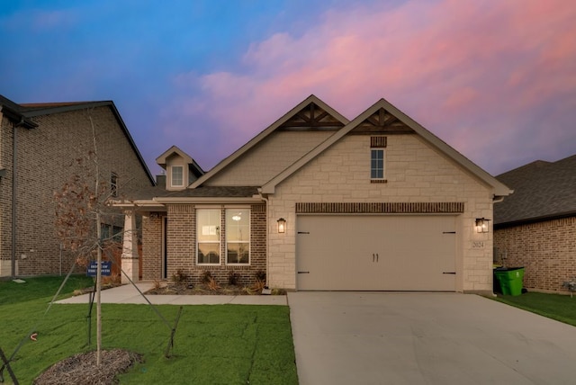 craftsman inspired home with a lawn and a garage