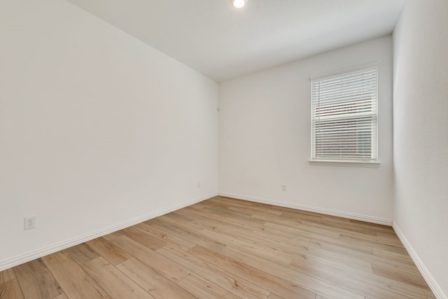 spare room with light hardwood / wood-style floors