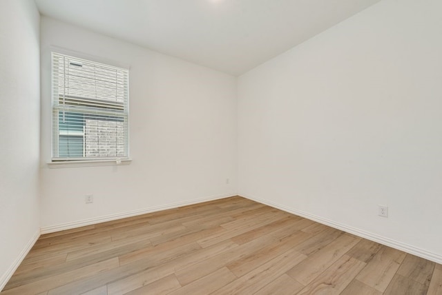 spare room featuring light hardwood / wood-style flooring