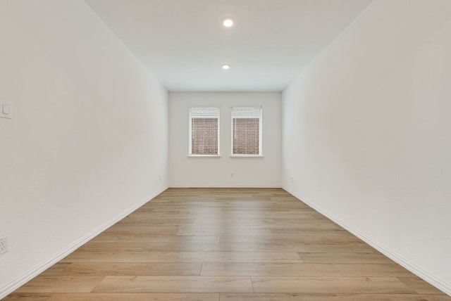 unfurnished room with light hardwood / wood-style flooring