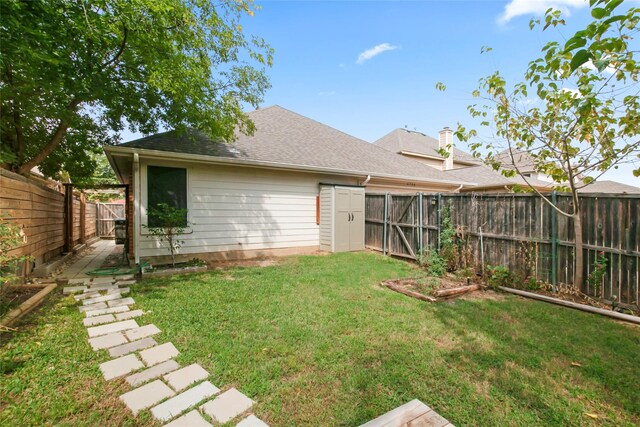 rear view of property featuring a yard