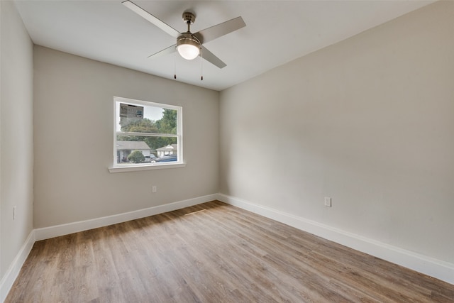 spare room featuring ceiling fan and light wood-type flooring