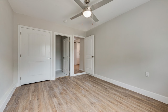 unfurnished bedroom featuring light hardwood / wood-style floors and ceiling fan