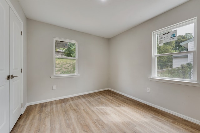 unfurnished room featuring light hardwood / wood-style flooring