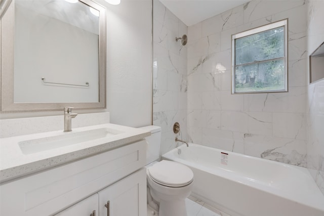 full bathroom featuring tiled shower / bath, vanity, and toilet