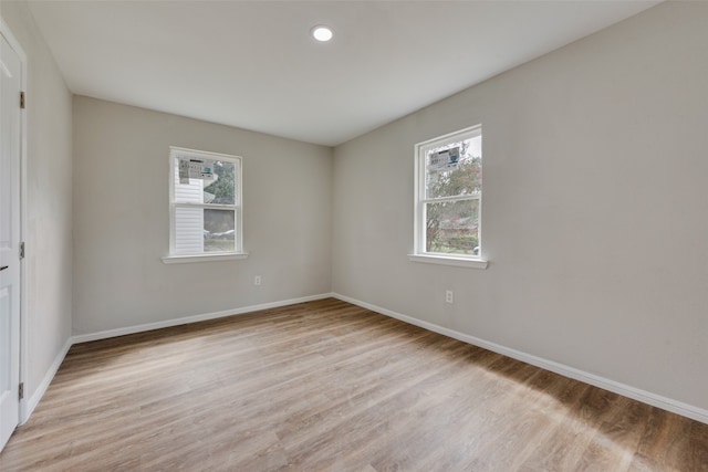 spare room featuring light hardwood / wood-style flooring