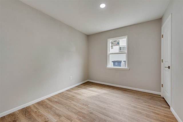 spare room with light hardwood / wood-style floors